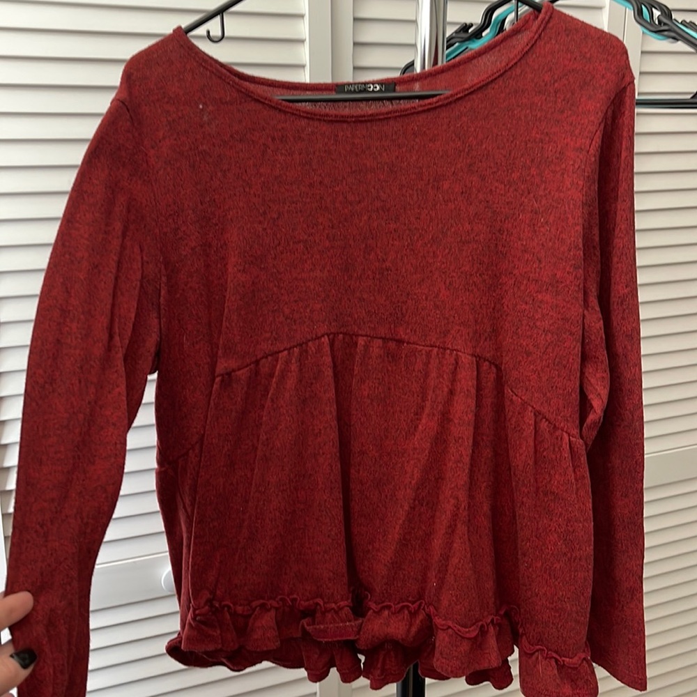 Thin dark red heathered looking sweater. Ruffle around bottom half.